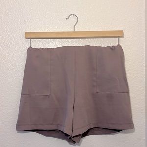 C by one, small lavender shorts.